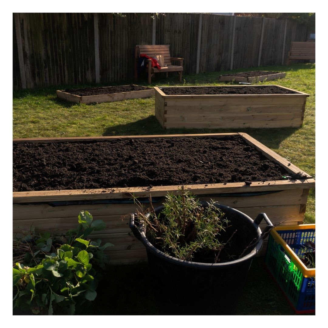 Eco Organic Soil Improver in a garden border