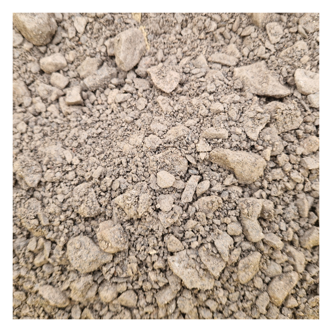 A close-up image of MOT Type 1 aggregate, showing a mix of crushed stones, ideal for creating strong and stable sub-bases for roads, paths, and construction projects.