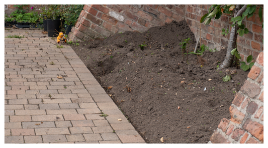 Image of piled up soil in a bed