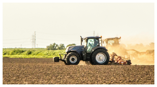 image showing tractors ploughing fields