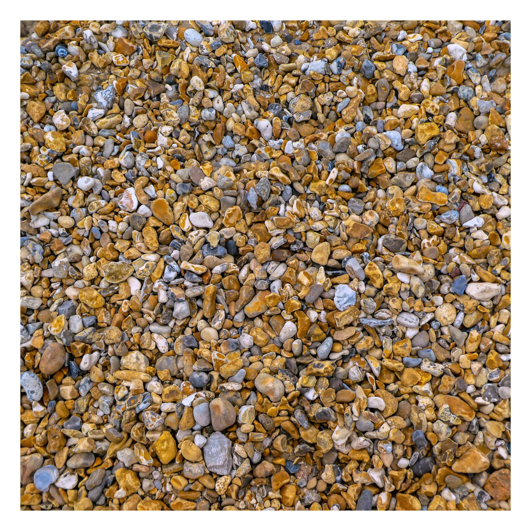 A detailed view of primary 20mm shingle, a clean and natural decorative aggregate, perfect for driveways, paths, and drainage solutions.