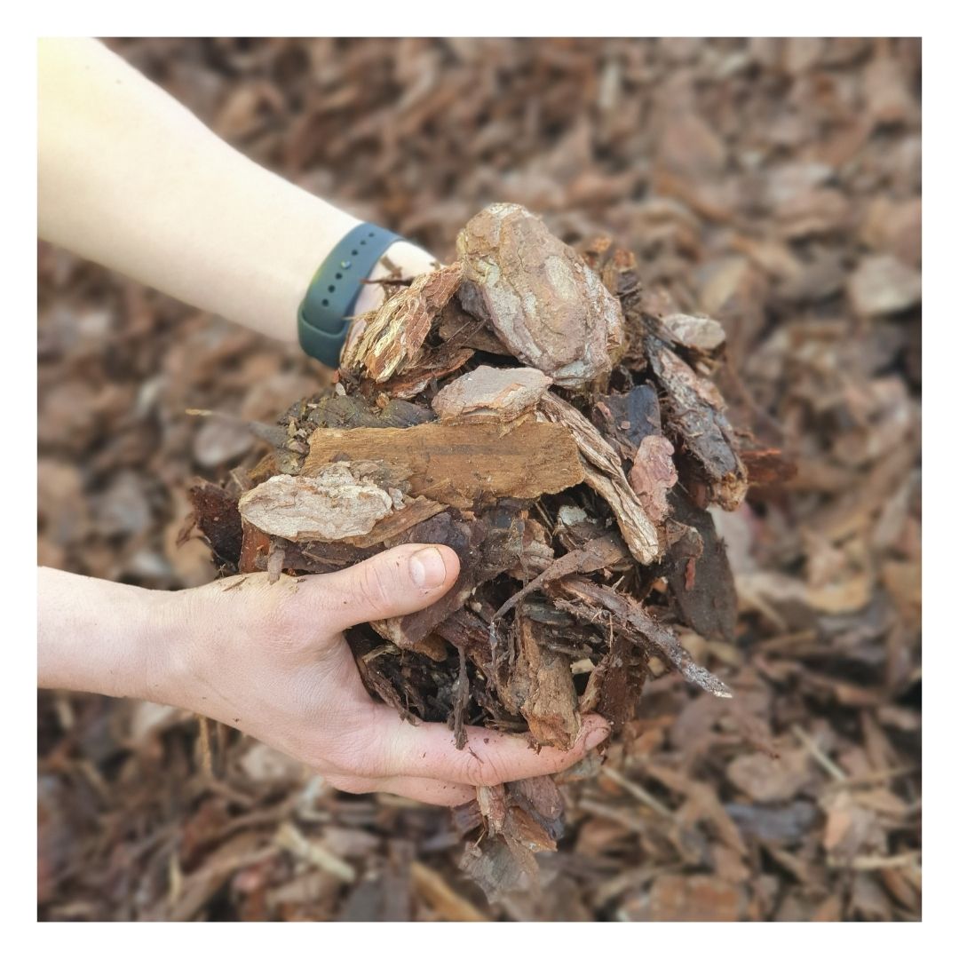 Hands holding Eco Bark Nuggets