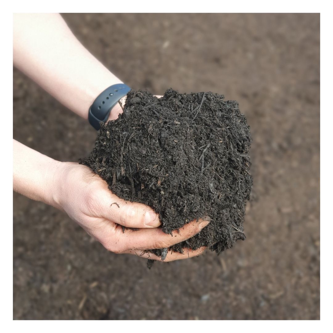 Hands holding Eco Organic Soil Improver