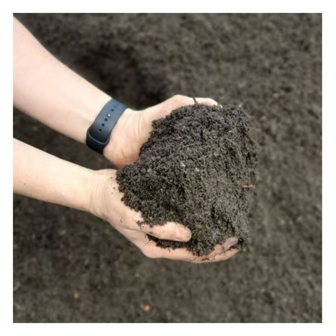 Hands holding Eco Organic Topsoil Beds & Borders