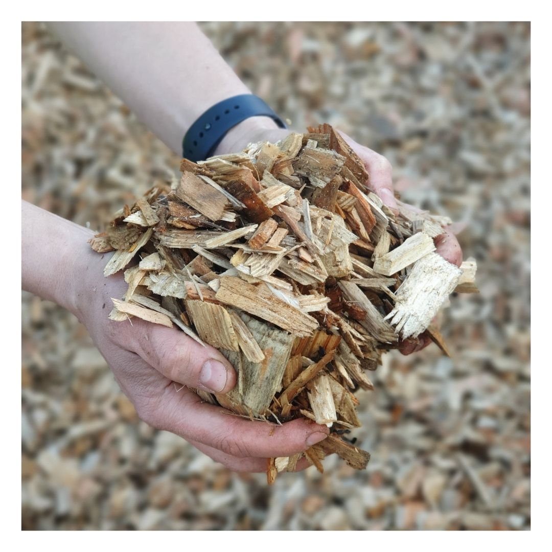 Hands holding Eco Playground Chippings