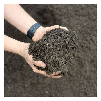 Hands holding Eco Turf & Lawn Seeding Soil