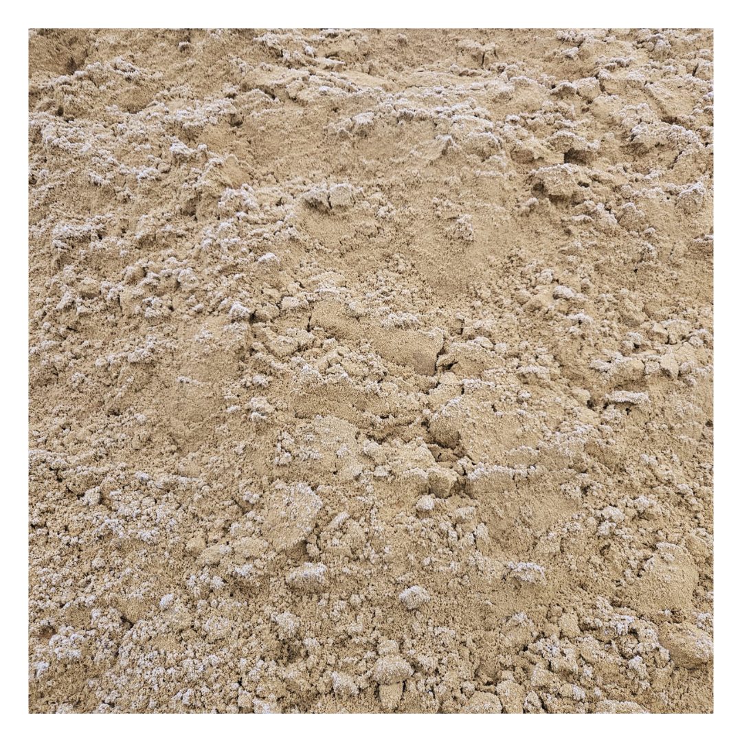  A close-up image of subsoil, showcasing its coarse and natural texture, ideal for creating stable foundations beneath topsoil in landscaping and construction projects.